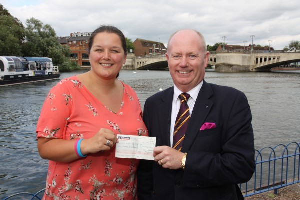Kevin presenting a cheque for £500 to Karen at the Crowne Plaza Hotel, Reading on 14th August 2018.
